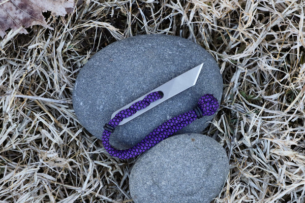 Banzelcroft Customs Nano kiridashi, a small fixed blade for everyday cutting tasks made from magnacut steel and acid purple diamond paracord.