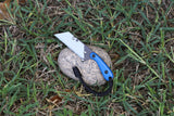 Banzelcroft Customs MEK, a custom titanium EDC utility knife with blue G10 handle scales.