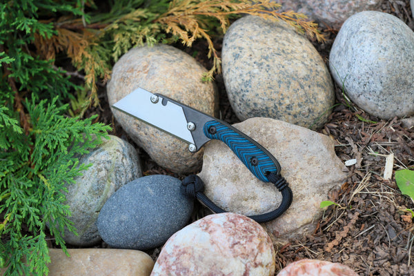 Banzelcroft Customs MEK, a custom titanium EDC utility knife with bluefin gcarta handle scales and black liners.