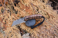 Banzelcroft Customs MEK, a titanium EDC utility knife with stabilized curly koa handle scales and canvas micarta liners.