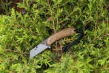Banzelcroft Customs MEK, a custom titanium EDC utility knife with glow in the dark burlap handle scales.