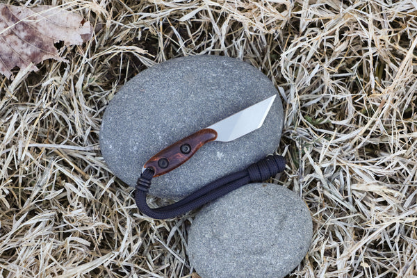 Banzelcrocft Customs micro kiridashi, a small fixed blade made of magnacut steel with Honduran rosewood burl handle scales and vintage Westinghouse liners.