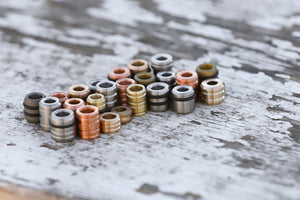 Banzelcroft Customs assorted beads in copper, brass, titanium, and bronze.