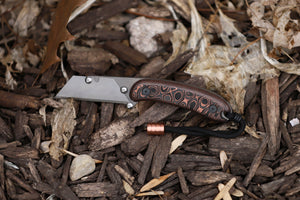 Banzelcroft Customs MEK, a titanium EDC utility knife with fat carbon uni copper handle scales.