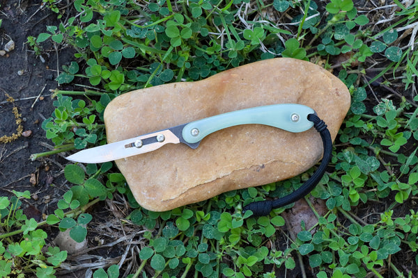 Banzelcroft Customs MEK, a custom titanium EDC scalpel knife with jade ghost g10 handle scales.