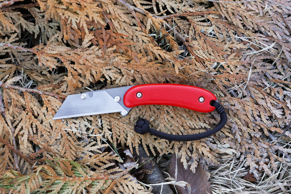 Banzelcroft Customs MEK, a custom titanium EDC utility knife with red G10 handle scales.