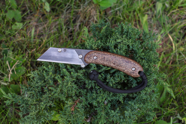 Banzelcroft Customs MEK, a custom titanium EDC utility knife with coconut husk micarta handle scales and natural canvas micarta liners.