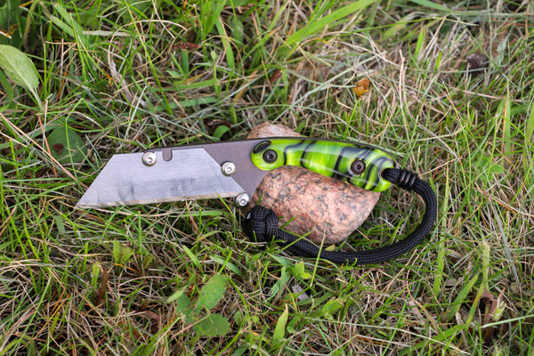 Banzelcroft Customs MEK, a custom titanium EDC utility knife with toxic green kirinite handle scales.