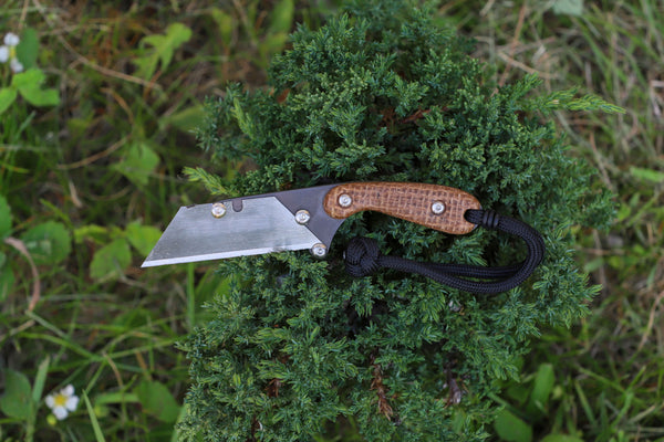 Banzelcroft Customs MEK, a custom titanium EDC utility knife with burlap micarta handle scales.