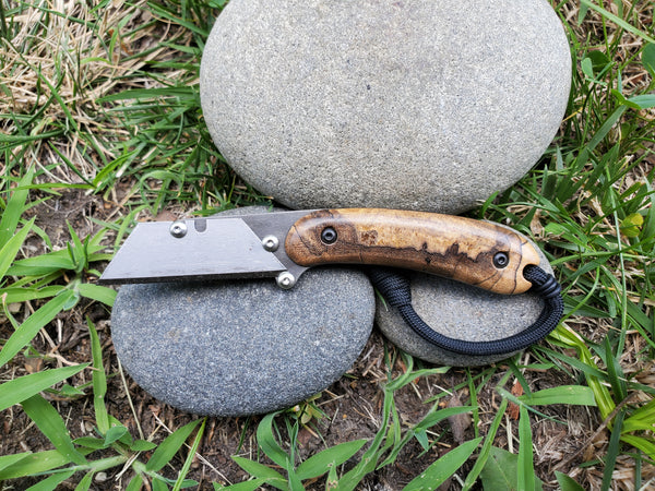 Banzelcroft Customs MEK, a custom titanium EDC utility knife with stabilized spalted maple burl handle scales.