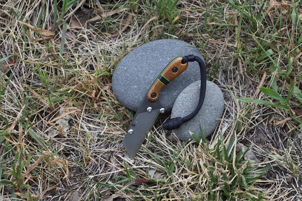 Banzelcroft Customs MEK, a custom titanium EDC utility knife with vibtag ecrushed canvas micarta and carbon fiber handle scales.