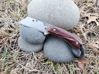 Banzelcroft Customs MEK, a custom titanium EDC utility knife with camatillo handle scales and natural canvas micarta liners.