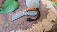 Banzelcroft Customs MEK, a custom titanium EDC utility knife with vintage crosscut canvas micarta scales and black liners.